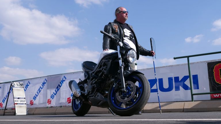 BLIND MAN RIDES MOTORCYCLE AROUND RACETRACK