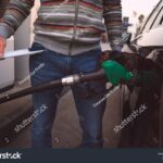 stock-photo-man-spend-all-his-money-on-gasoline-expensive-gasoline-high-petrol-and-fuel-prices-2137047105