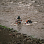 William Slater and Matt Green making it across a deep river crossing during Day 2 of Roof of Africa, by ZCMC